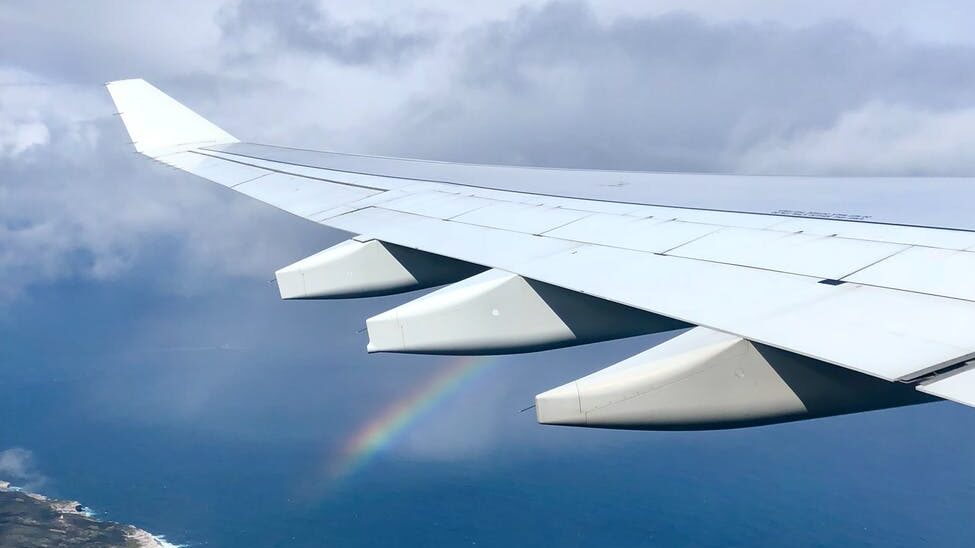 airplane wing with rainbow