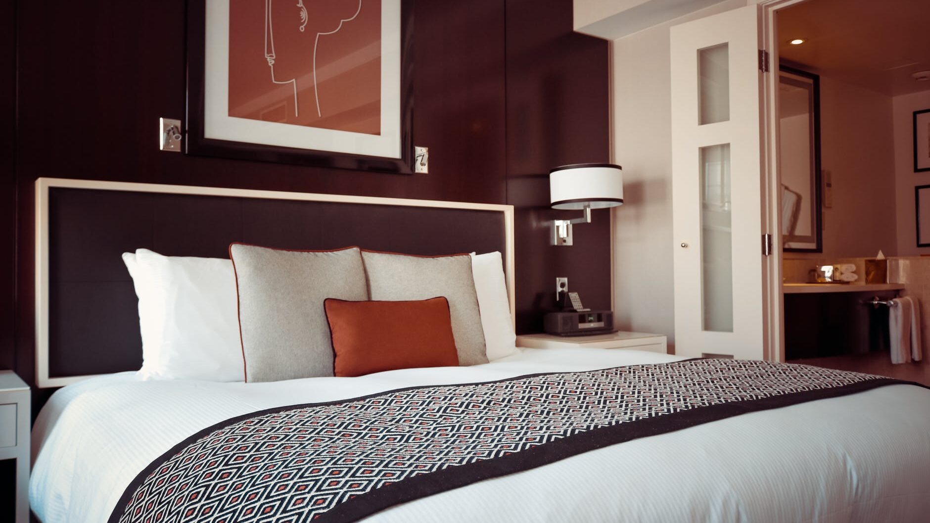 black and grey bedspread on bed and pillow